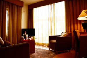 Uma TV ou centro de entretenimento em Hotel Jose Alberto