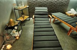 a row of stools in a room with a wall at Apartments Lipa Plac in Postojna