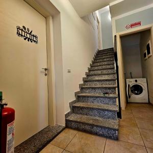 a staircase in a building with a washing machine at Borgo Paradiso Guest House in Maccagno Inferiore +21 photos
