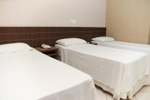 Postel nebo postele na pokoji v ubytování Hotel Villa Canoas