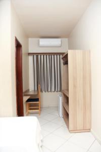 Postel nebo postele na pokoji v ubytování Hotel Villa Canoas