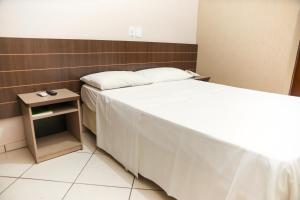 Postel nebo postele na pokoji v ubytování Hotel Villa Canoas