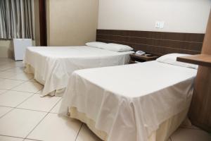 Postel nebo postele na pokoji v ubytování Hotel Villa Canoas