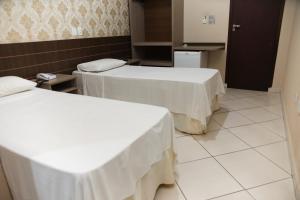Postel nebo postele na pokoji v ubytování Hotel Villa Canoas