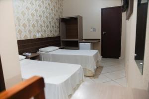 Postel nebo postele na pokoji v ubytování Hotel Villa Canoas