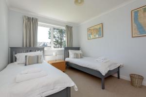 a bedroom with two beds and a window at Westerham in North Berwick