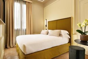 Postel nebo postele na pokoji v ubytování Floren Hotel