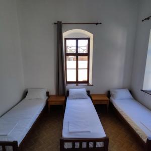 Ein Bett oder Betten in einem Zimmer der Unterkunft Rhodes Youth Hostel