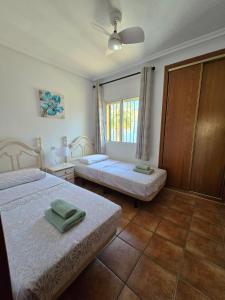 Katil atau katil-katil dalam bilik di Aldeas De Aguamarina Phase II Townhouse +2 gambar
