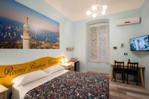 Postel nebo postele na pokoji v ubytování Rooms Boutique Carducci