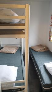 a couple of bunk beds in a room at mobil home carnac in Carnac