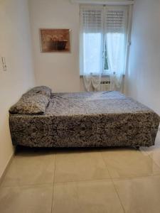 Un pat sau paturi într-o cameră la Martina house