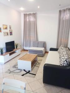 a living room with a couch and a tv at Villa Jovan Gevgelija in Gevgelija +75 photos