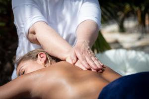a woman getting a massage from a therapist at La Pura Vida 34 in Pignan