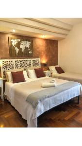 A bed or beds in a room at Rizzi Marianna B&B