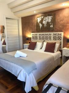 A bed or beds in a room at Rizzi Marianna B&B