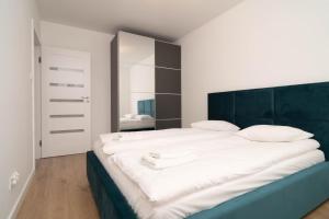 Posteľ alebo postele v izbe v ubytovaní Przystań Letnica by Comfort Apartments