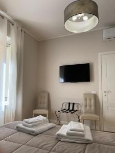 Televízia a/alebo spoločenská miestnosť v ubytovaní Luxury Apartament's Celso