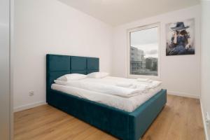 Posteľ alebo postele v izbe v ubytovaní Przystań Letnica by Comfort Apartments