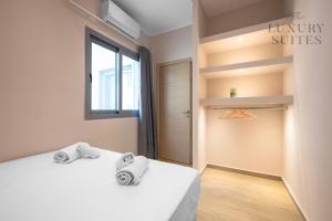 Posteľ alebo postele v izbe v ubytovaní Aelia Apartments, The Luxury Suites