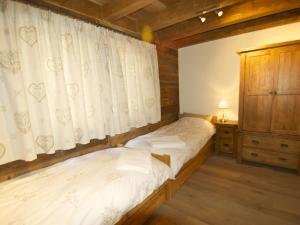 Postel nebo postele na pokoji v ubytování Chalet Jean