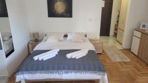 a bedroom with a large bed with white pillows at MD dream in Novi Sad