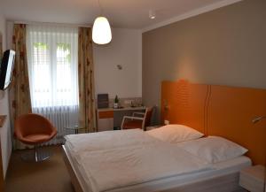 Katil atau katil-katil dalam bilik di Hotel Zur Mühle