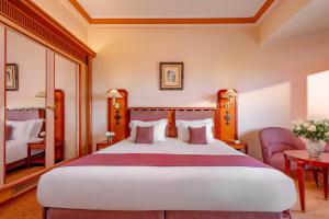 Postel nebo postele na pokoji v ubytování Es Saadi Marrakech Resort - Hotel + 37 fotografií