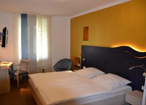 Postel nebo postele na pokoji v ubytování Hotel Zur Mühle
