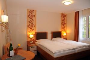 Postel nebo postele na pokoji v ubytování Hotel Zur Mühle