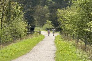 two people walking down a dirt road at Rowsley Cottage Bakewell Peak District in Bakewell