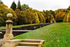 a set of stairs in a park with trees at Rowsley Cottage Bakewell Peak District in Bakewell