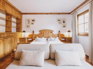 Postel nebo postele na pokoji v ubytování Landhaus Lodges Kaprun by we rent