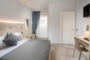 Posteľ alebo postele v izbe v ubytovaní B&B Primrose Residence Hotel
