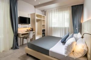 Posteľ alebo postele v izbe v ubytovaní B&B Primrose Residence Hotel