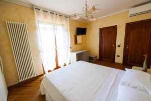 Postel nebo postele na pokoji v ubytování Bed and Breakfast a casa di Valerio