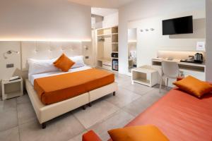 Posteľ alebo postele v izbe v ubytovaní B&B Primrose Residence Hotel