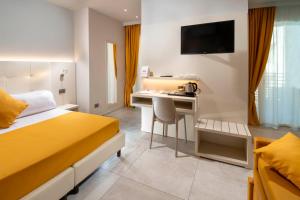 Posteľ alebo postele v izbe v ubytovaní B&B Primrose Residence Hotel