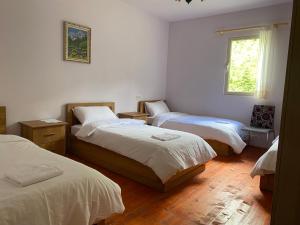 Postel nebo postele na pokoji v ubytování VITA Guesthouse