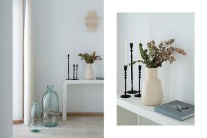 two pictures of vases with flowers on a shelf at Casa nueva con piscina privada y solárium in Alcalá de Guadaira