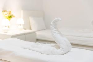 Posteľ alebo postele v izbe v ubytovaní Haven Apartman Zamárdi By BLTN
