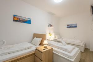 Posteľ alebo postele v izbe v ubytovaní Haven Apartman Zamárdi By BLTN + 28 fotografií