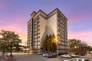 a rendering of a building with a parking lot at Best Western Plus Atlanta Airport East in Atlanta