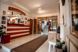 a store lobby with a flag painted on the wall at Vila Riki in Borsec