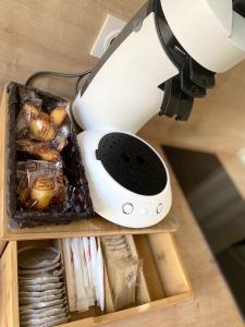 a white blender sitting on top of a table at La chambre de Madeleine in Commercy +11 photos