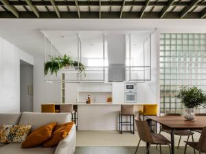 a living room with a couch and a table at Arribada by Estela do Mar in Baiona