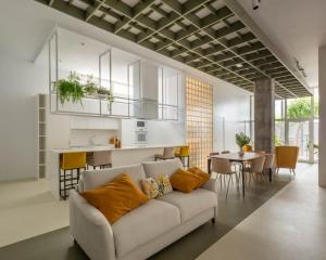 a living room with a white couch and a table at Arribada by Estela do Mar in Baiona