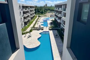 an aerial view of a pool at a apartment complex at Makia Beach Experience in Ipojuca