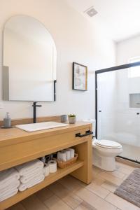 a bathroom with a sink and a toilet at New Casa Balandra with Gated Parking at Casas Sanblu in Ensenada +33 photos