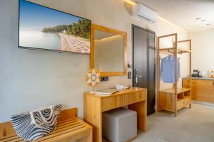 a bathroom with a desk and a mirror and a sink at Luminous luxury living in Kallithea Halkidikis